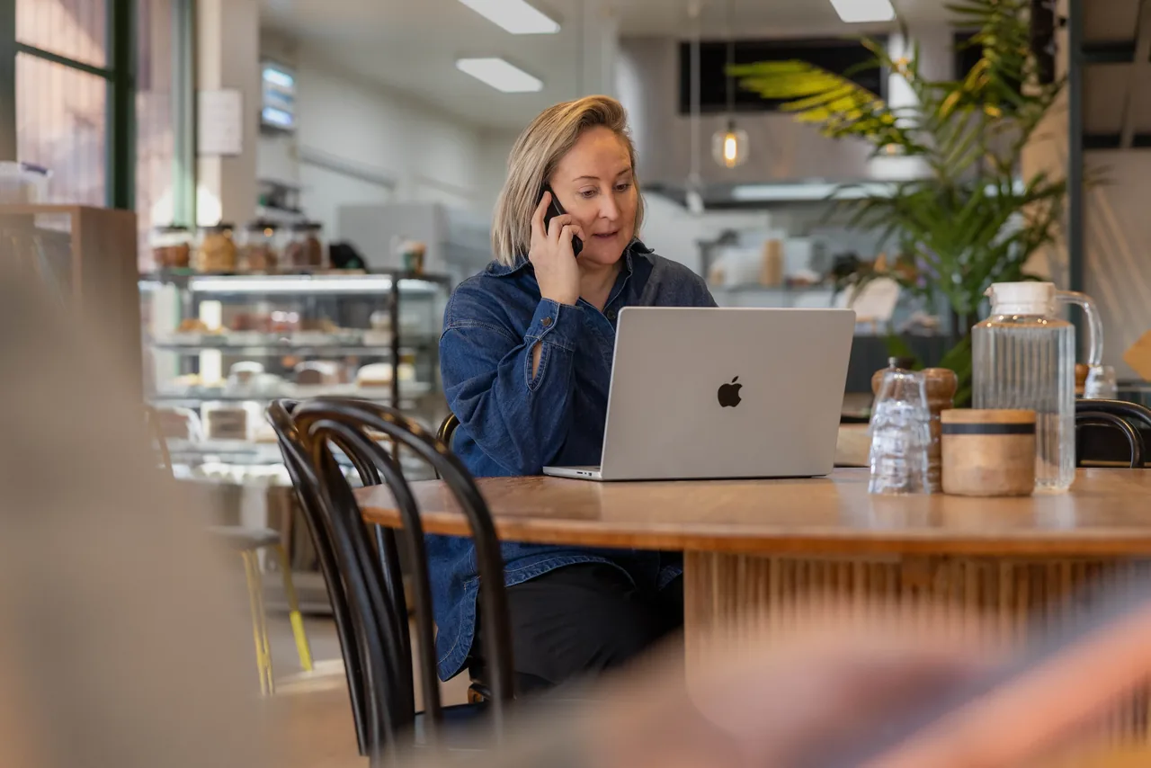 A Tonkin team member working on a MacBook away from the office